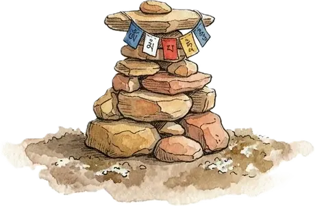 A cairn of stacked trail stones strung with prayer flags, marking the way